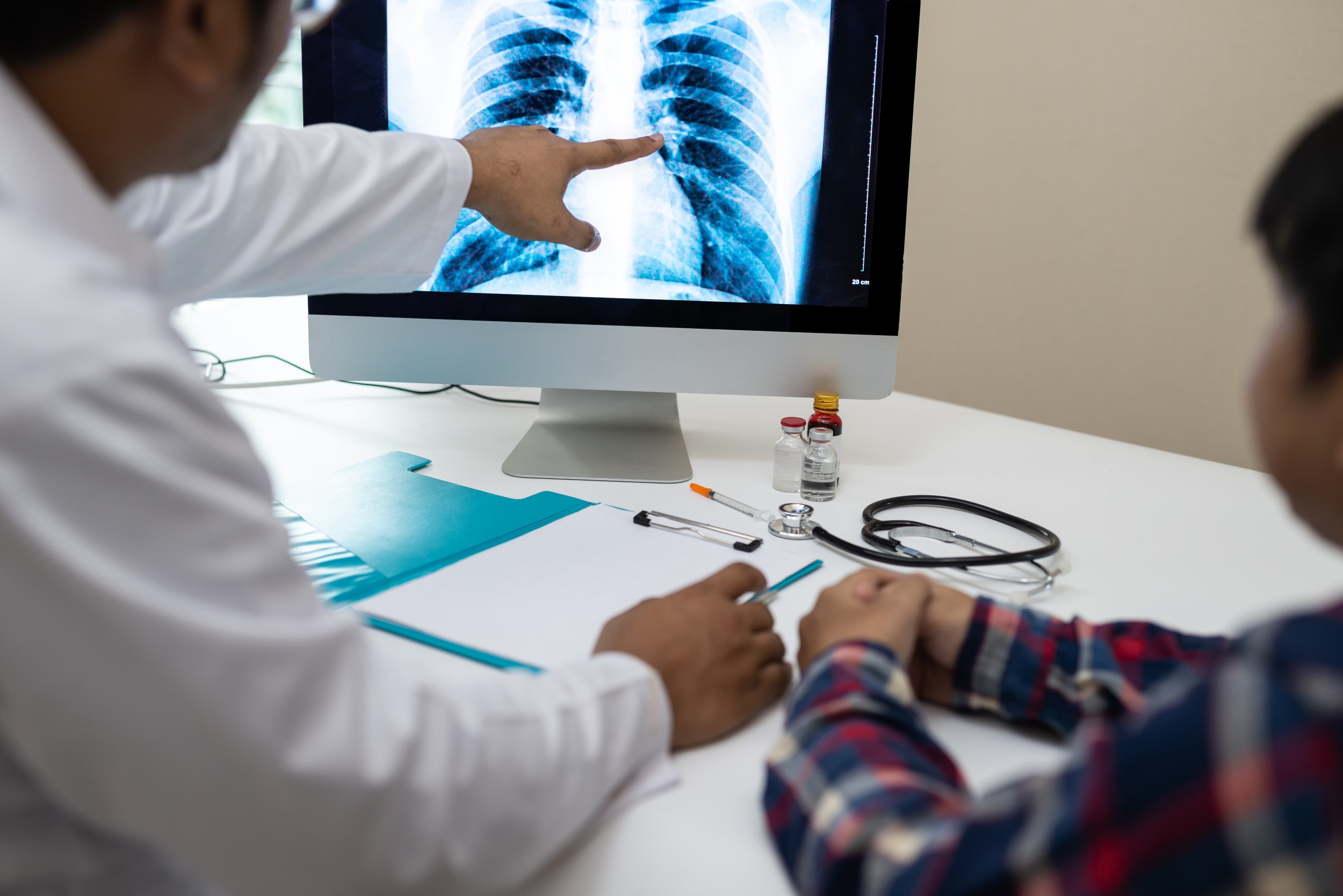 Professional doctor and radiologist giving a consultation to his patien